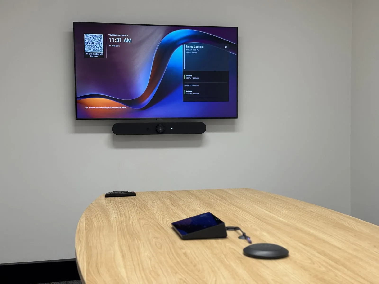 A RAAFA WA meeting room with a wall-mounted display and video bar showing the room's booking screen