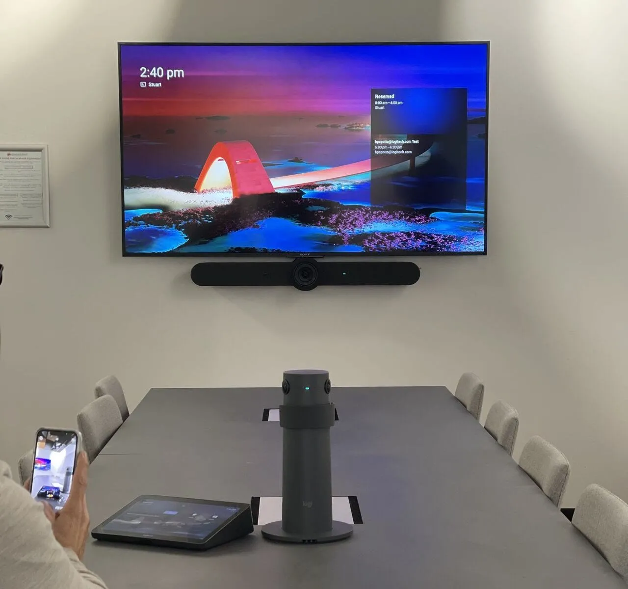 A Focus AV room at Spacecubed in Perth — an all-in-one video bar under the wall display, a centre-of-table camera and a touch controller on the boardroom table