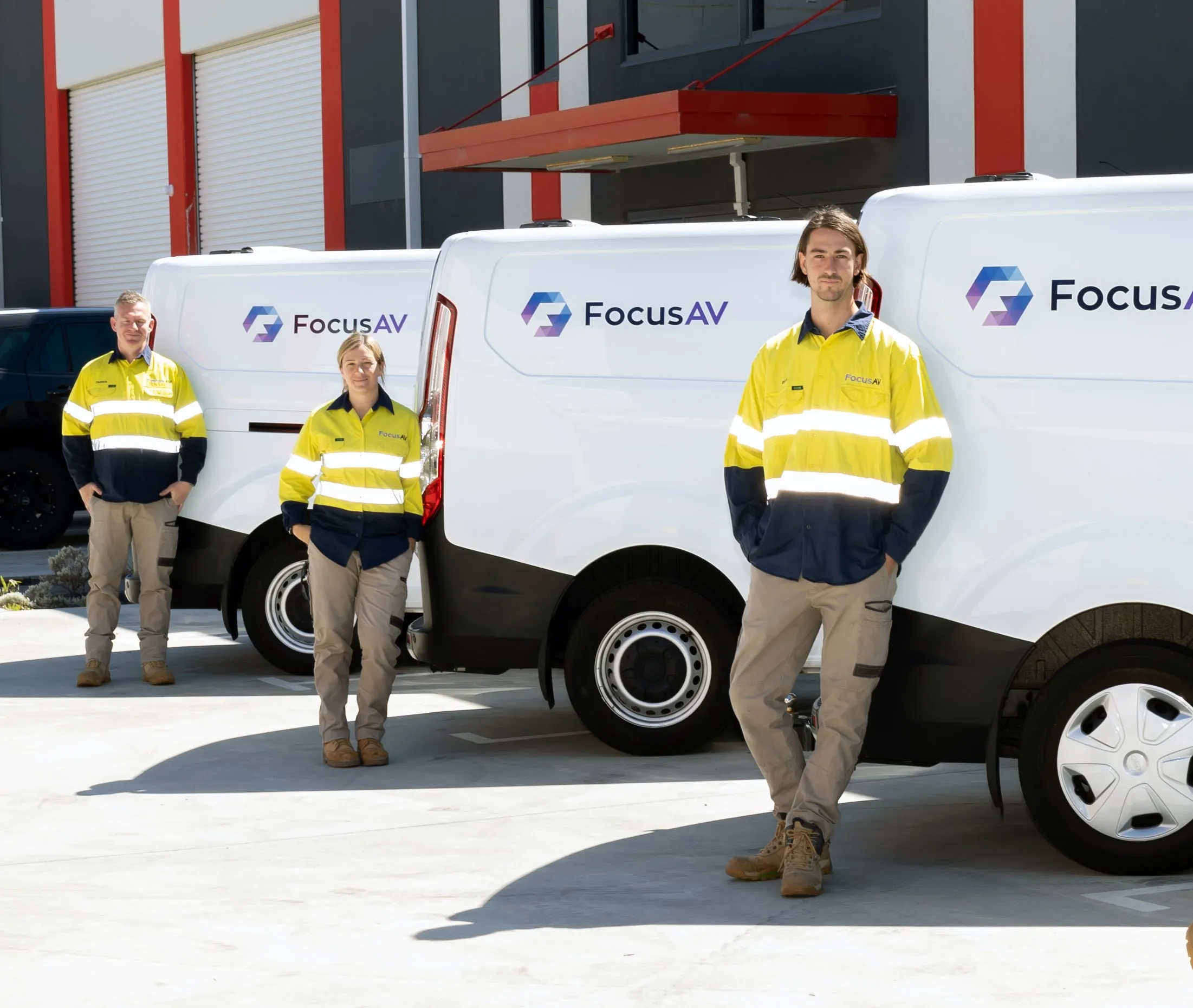 Focus AV team members with the branded van fleet outside the Gnangara workshop