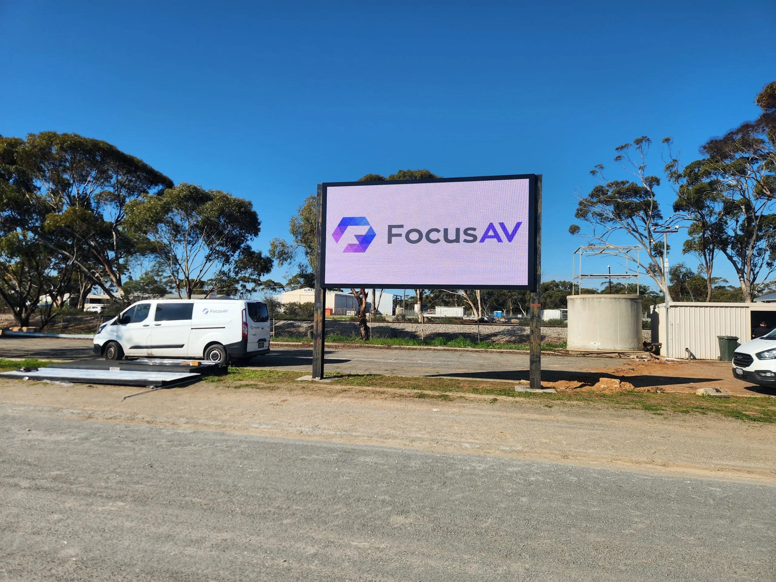 Finished outdoor LED screen in Moora running the Focus AV logo, branded van alongside