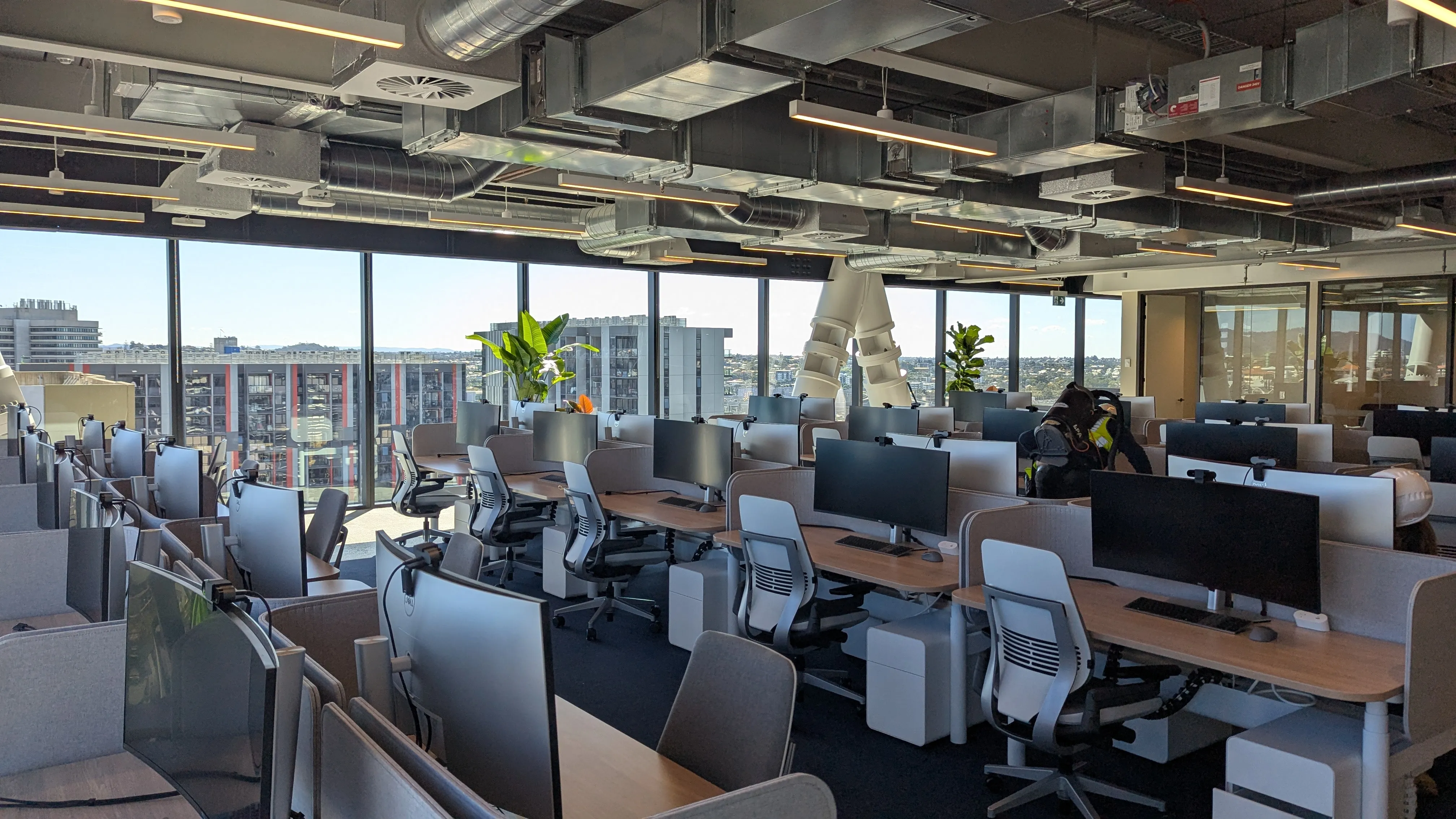 Open-plan workstations at a Newmont Brisbane office, the space Focus AV walked and assessed