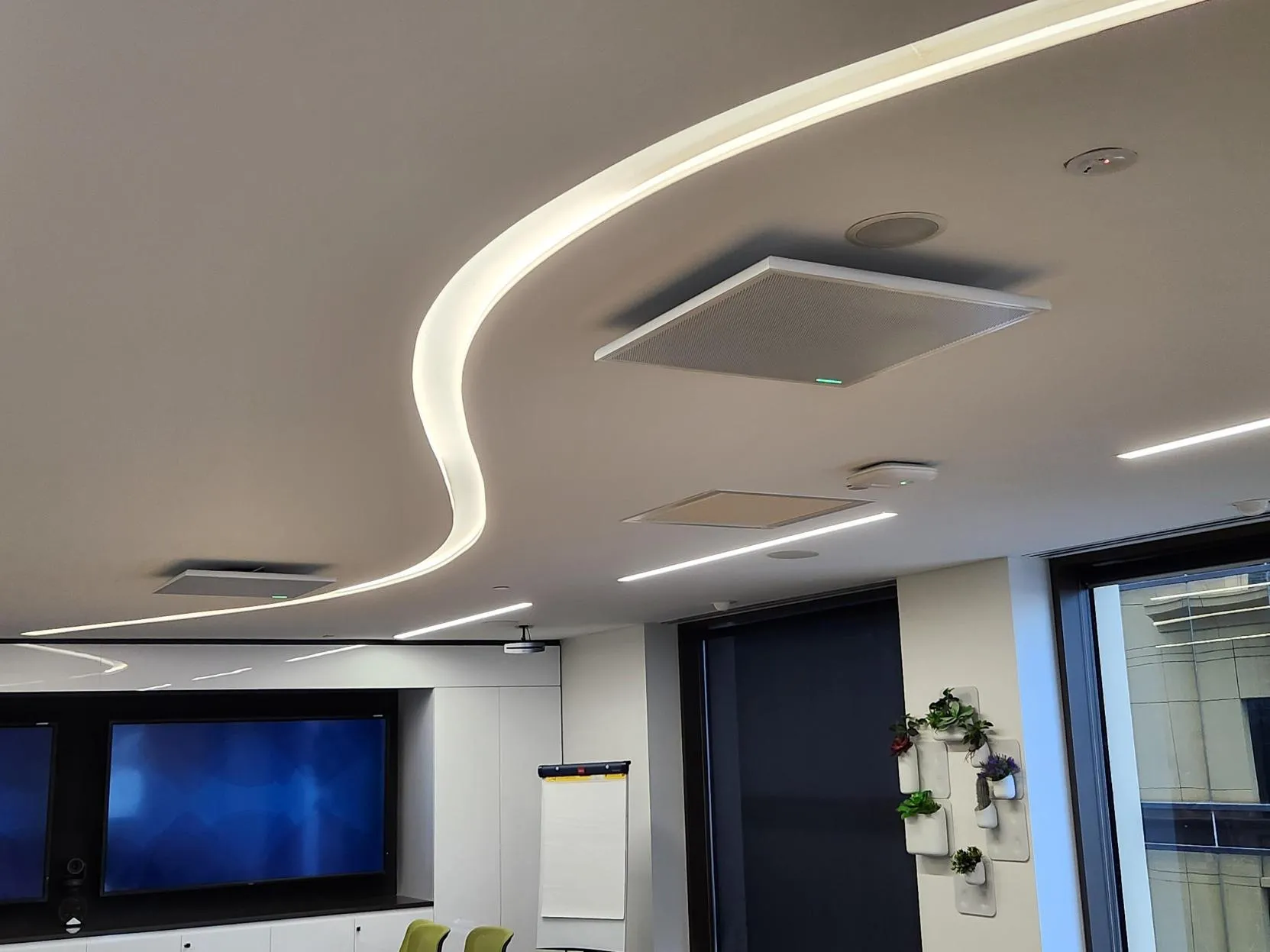 Ceiling downlights and mic array above the boardroom table