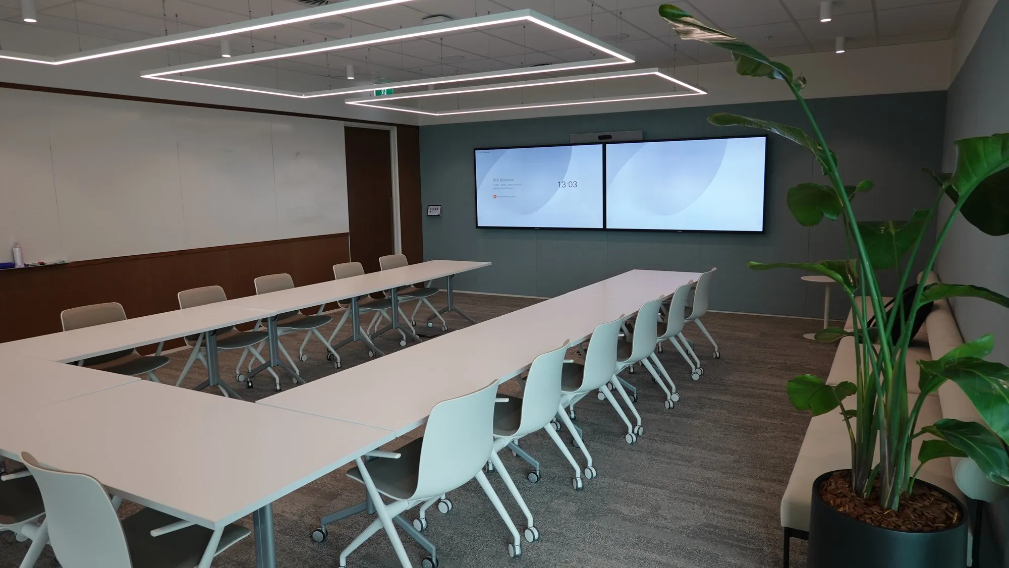 A modern Perth training room configured in a U-formation with flip-top wheeled tables