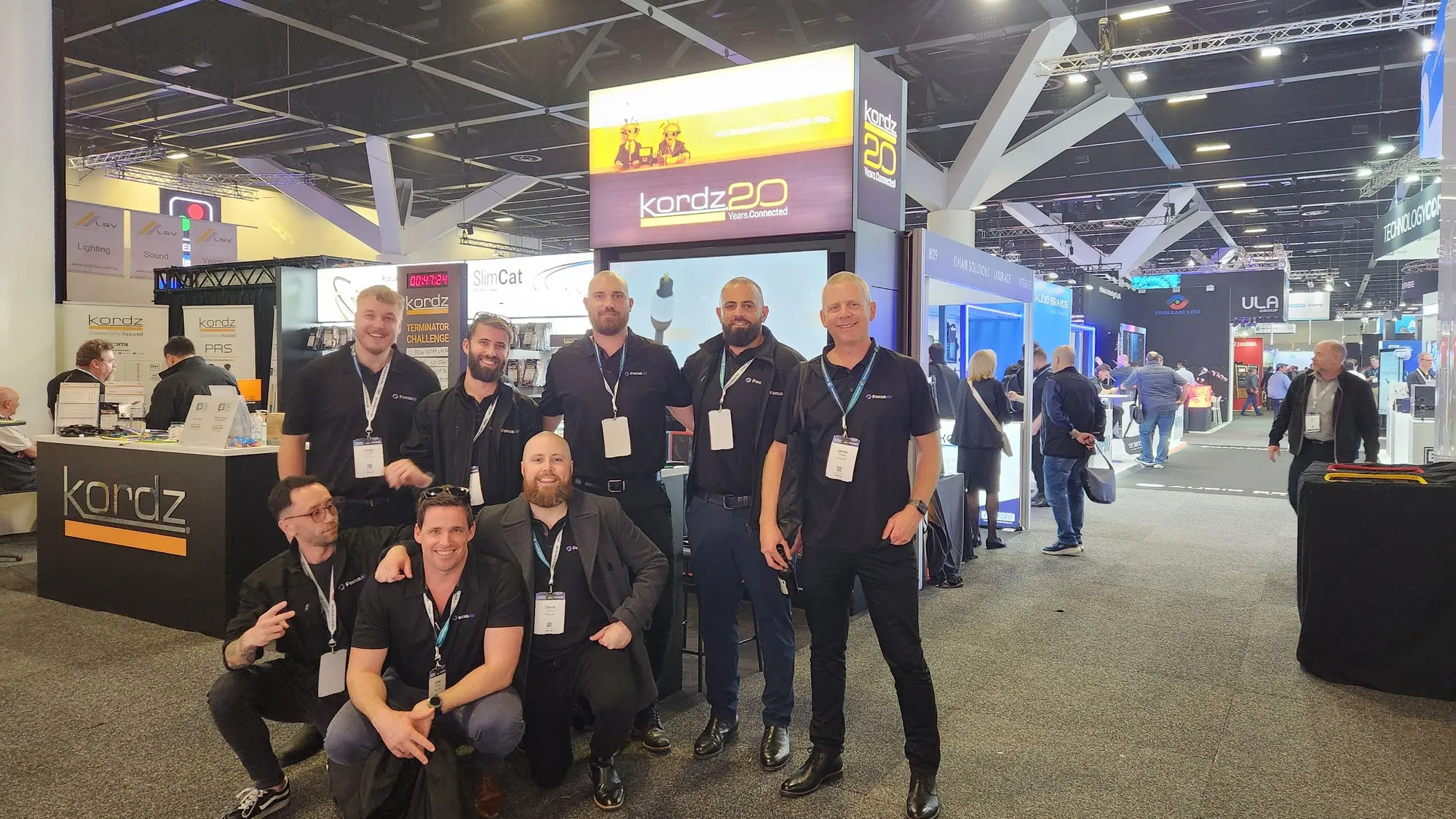 The Focus AV team on the floor at an AV industry trade show — the people who take on the projects that don't fit a category