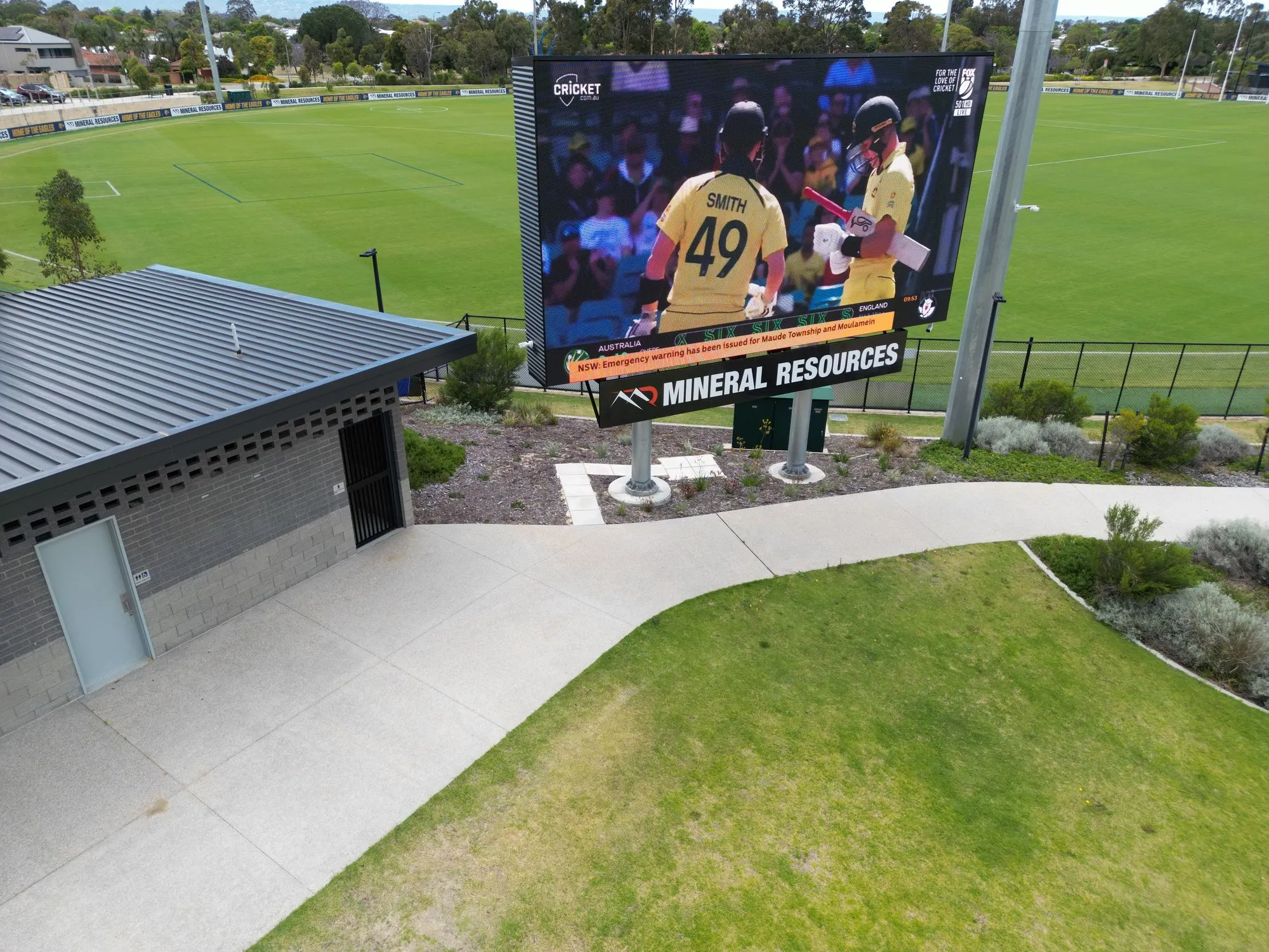 The West Coast Eagles LED board running full-motion player video, seen from above the training oval